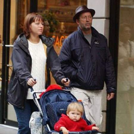 A picture of toddler Julie Rose Clapton with her parents, Eric Clapton and Melia McEnery. 